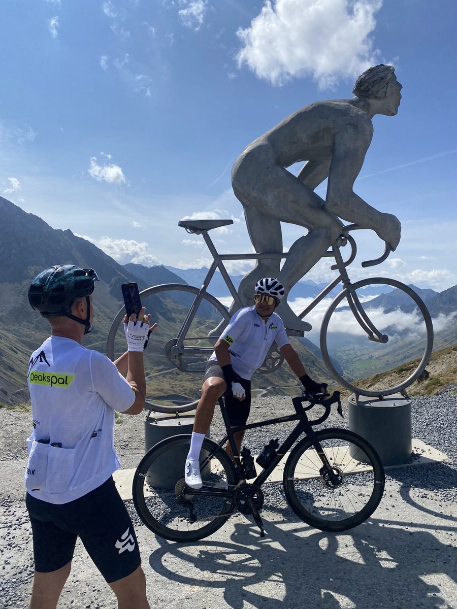 Two PeaksPal riders at the Octave Lapize monument on the Col du Tourmalet