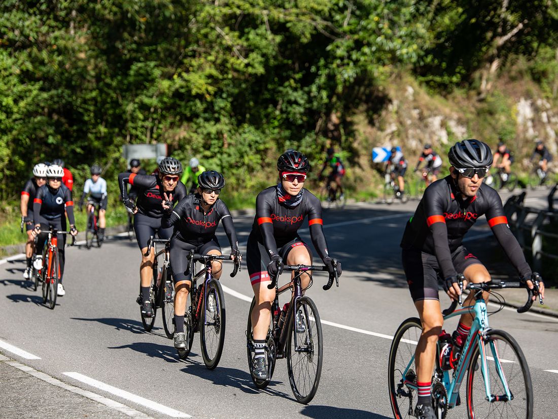 PeaksPal riders climbing together on a mountain road