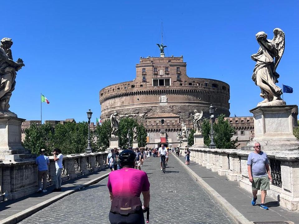 A rider crossing the bridge towards Castel Sant Angelo in Rome