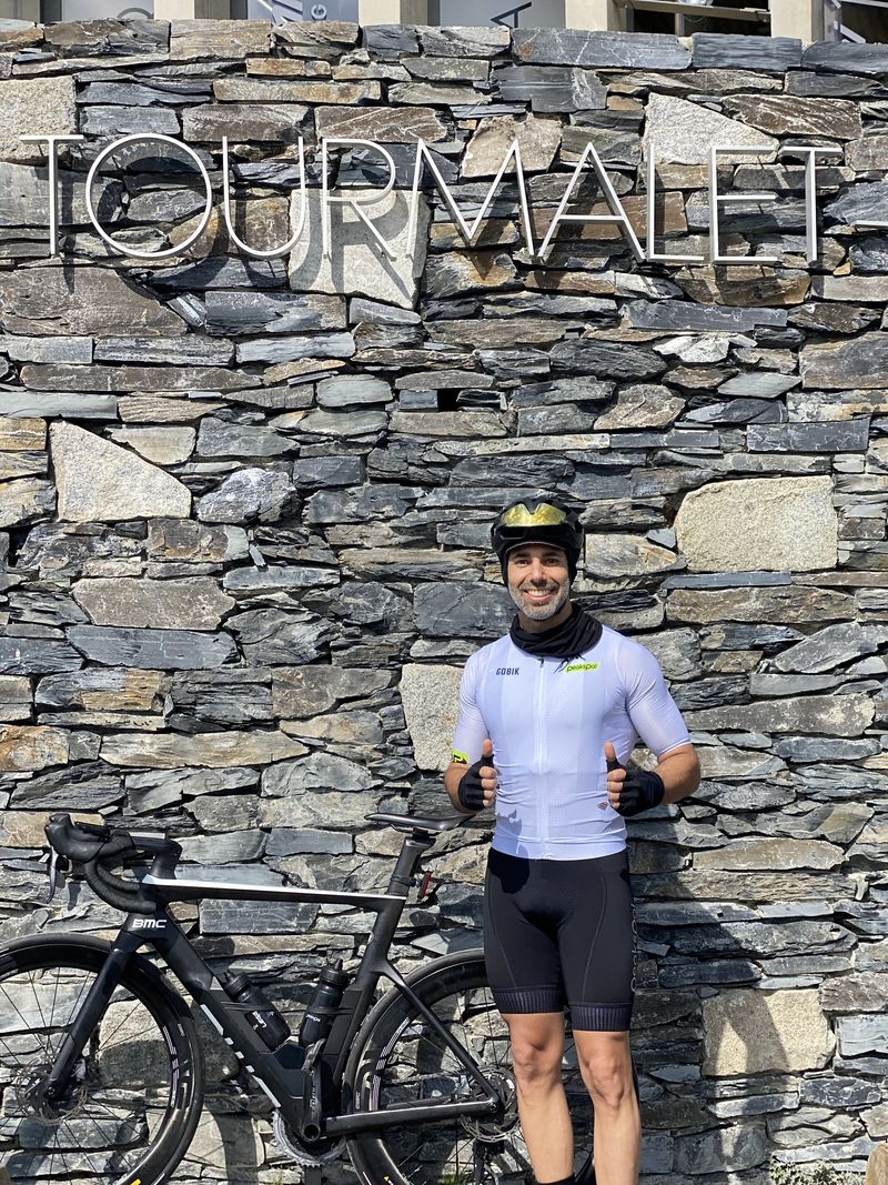 A rider at the Tourmalet summit sign after the climb